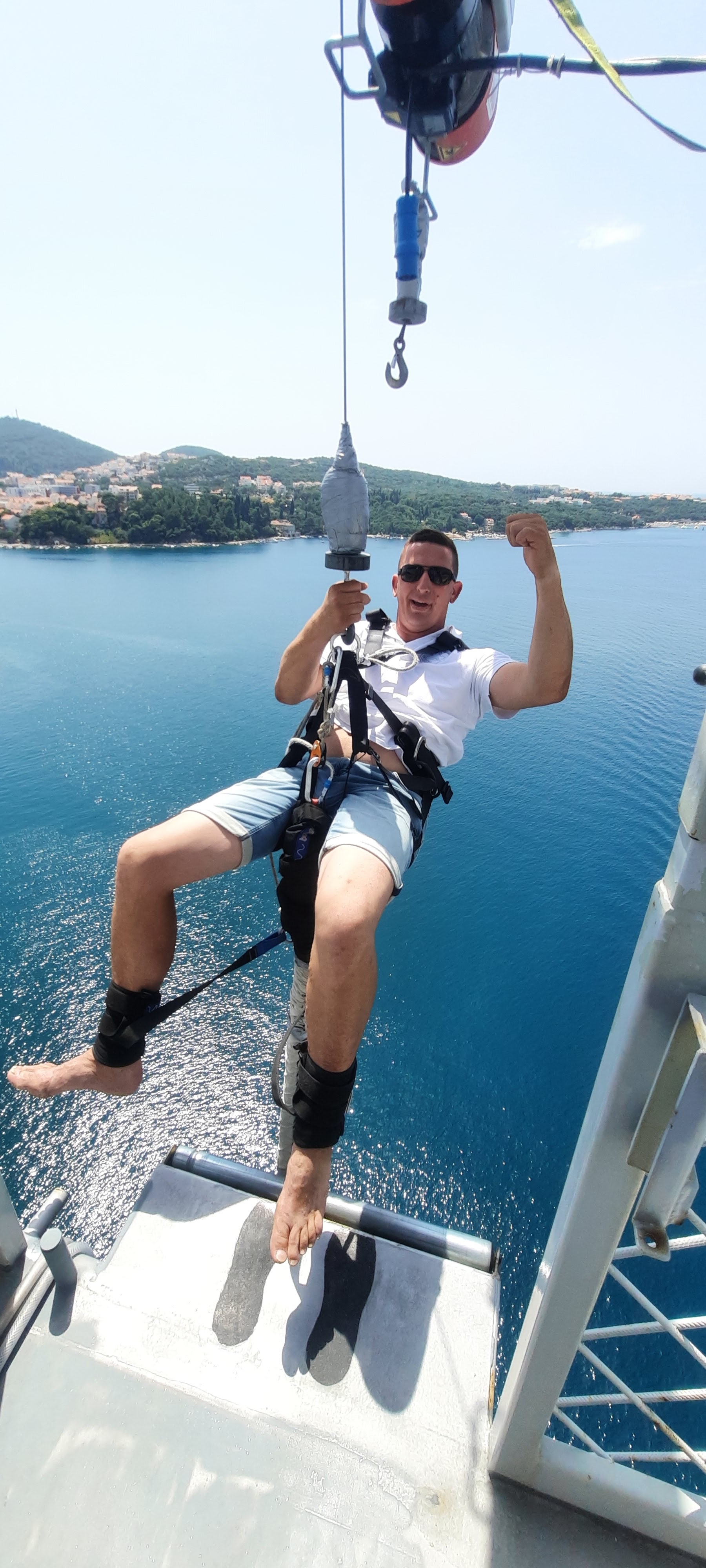 Participant suspended mid-air during a Dubrovnik Bungee Jump above the Adriatic Sea