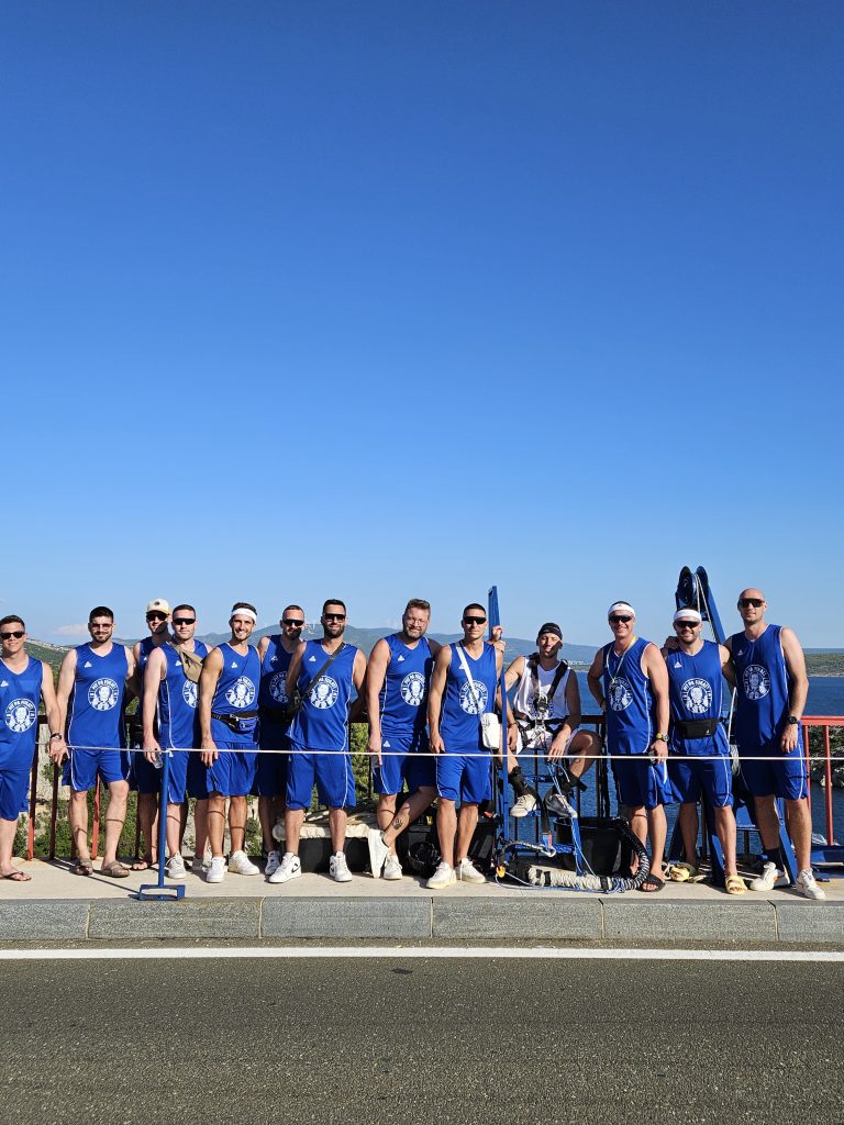 Basketball team posing after bungee jumping at Maslenica Bridge